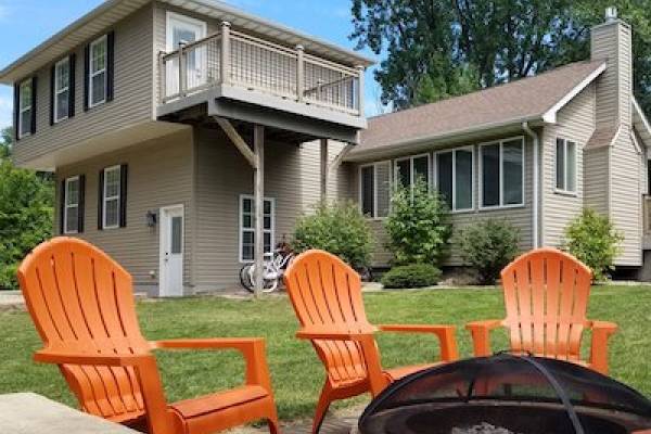 view of home's exterior from the fire pit area