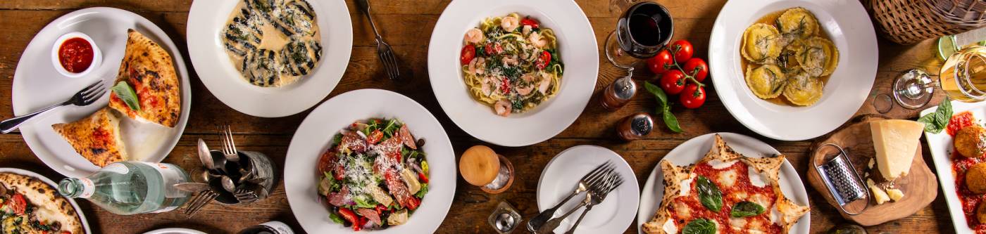 aerial view of a table set with Italian food dishes